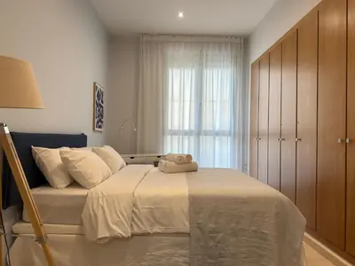 a bedroom with a bed with a teddy bear on it at Reinapart Patacona Balcony Seaview in Valencia