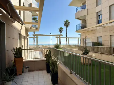 an apartment balcony with a view of the beach at Reinapart Patacona Balcony Seaview in Valencia