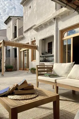 a patio with a couch and a table at Casa Salvoreta in Valencia