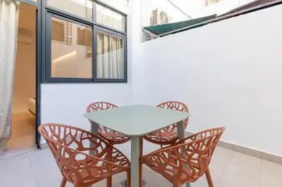 a dining room with a table and chairs at My Loft 4 You Democracia II in Valencia