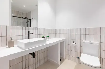 a bathroom with a sink and a toilet at My Loft 4 You Democracia II in Valencia