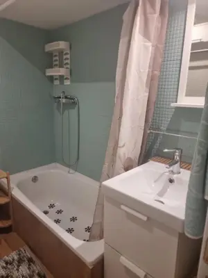 a bathroom with a tub and a sink and a shower at District Key - Puerto de Sagunto, Virgen Losar in Puerto de Sagunto