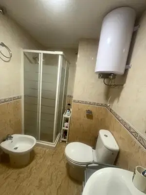 a bathroom with a toilet and a sink and a shower at Raquel Host Moncofar in Moncófar
