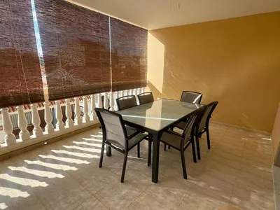 a dining room with a glass table and chairs at Raquel Host Moncofar in Moncófar