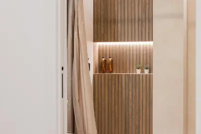 a room with a shelf with bottles on it at FLORIT FLATS - The Maritim Studios in Valencia