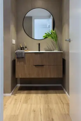 a bathroom with a sink and a mirror at VLC Host - Belgica Apartments in Valencia