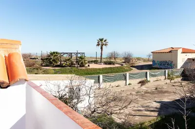 a view of the ocean from the roof of a house at Global Vacacional, Deslumbrante casa en la playa de Sagunto in Sagunto