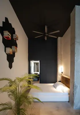 a bedroom with a white bed and a ceiling fan at Crudo un Loft centrico de 50 m2 in Valencia