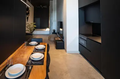a kitchen with a wooden table with plates on it at Crudo un Loft centrico de 50 m2 in Valencia