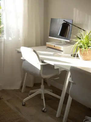 a white desk with a computer monitor and a chair at GuestReady – Luminous City Getaway in Valencia