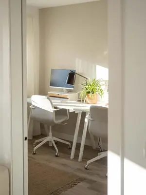 an office with a desk with a computer and two chairs at GuestReady – Luminous City Getaway in Valencia