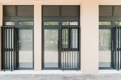 a facade of a building with black doors and windows at Fantastico Apartamento en Valencia in Valencia