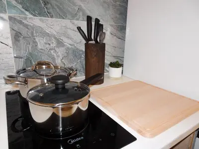 two pots and pans on a stove in a kitchen at JB22 - Loft Valencia in Valencia