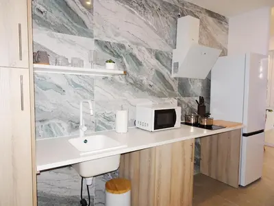 a kitchen with a sink and a microwave on a counter at JB22 - Loft Valencia in Valencia