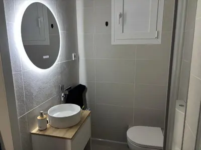 a white sink with a faucet in a bathroom at Vista al mar con piscina in Faro de Cullera