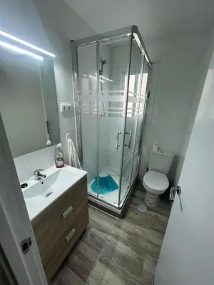 a bathroom with a shower and a sink and a toilet at Apartamento acogedor playa Cullera in Cullera