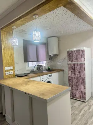a kitchen with a counter top and a stove at Apartamento acogedor playa Cullera in Cullera