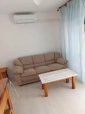 a living room with a couch and a coffee table at BRISA DEL MAR en primera línea in Torres-Torres