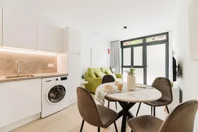a kitchen and living room with a table and chairs at Apartamento en Valencia in Valencia