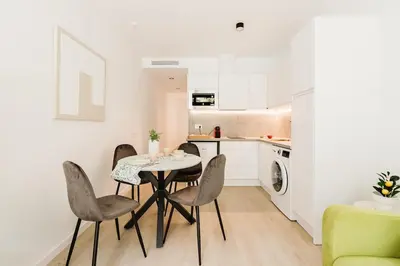 a kitchen and dining room with a table and chairs at Apartamento en Valencia in Valencia