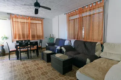 a bedroom with a bed and a chair and a piano at Las Salericas in Chella