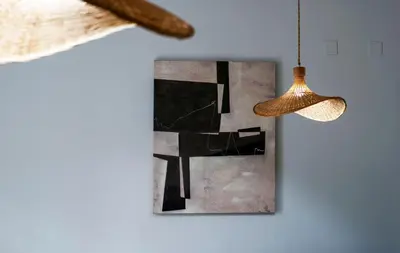 a hanging lamp and a picture on a wall at VLC HOST - Linterna in Valencia