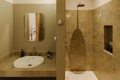a bathroom with a sink and a shower at Casa Lina in Valencia