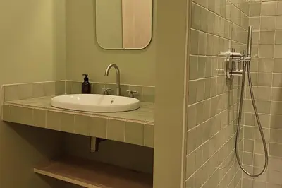 a bathroom with a sink and a shower at Casa Lina in Valencia