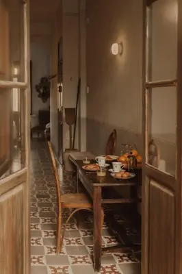 a dining room with a table with food on it at Casa Rosalia in Valencia