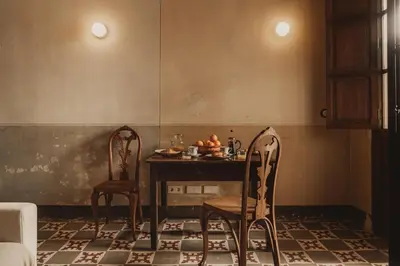 a dining room with a table and two chairs at Casa Rosalia in Valencia