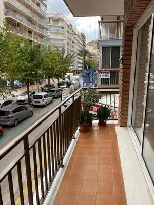 a balcony with a view of a street with cars at Apartamento en Cullera playa con amplio balcón in Cullera
