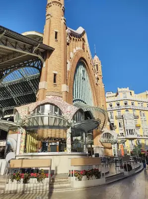 a large building with a clock tower on a street at LUXURY APARTMENT SCIENCES CITY Valencia B in Valencia