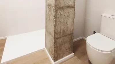 a bathroom with a toilet and a stone pillar at LUXURY APARTMENT SCIENCES CITY Valencia B in Valencia