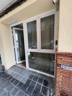 a sliding glass door on the side of a house at Las Arenas 1 Apartamento Playa in Valencia