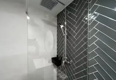 a bathroom with a shower with a glass wall at Las Arenas 1 Apartamento Playa in Valencia