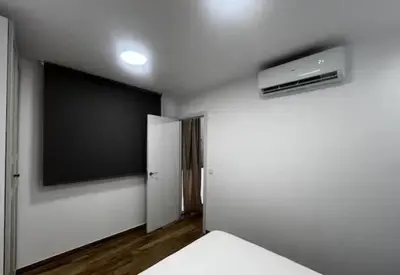 a room with a bed and a flat screen tv at Las Arenas 1 Apartamento Playa in Valencia