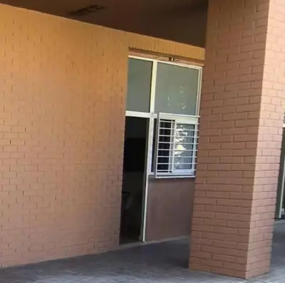 a brick building with a door and a window at Nuevo acogedor cerca del Centro in Valencia