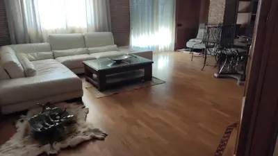 a living room with a couch and a coffee table at fully-equipped luxury penthouse in Almácera