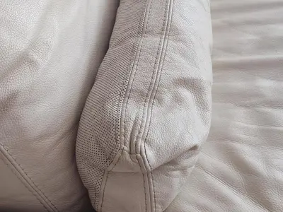 a close up of the seams of a white pillow at fully-equipped luxury penthouse in Almácera