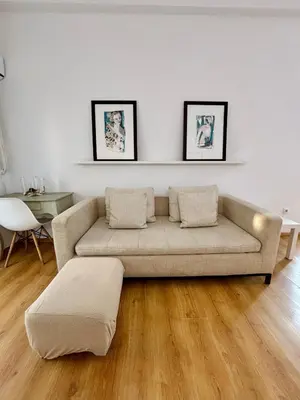 a living room with a couch and a table at Reina loft in Valencia