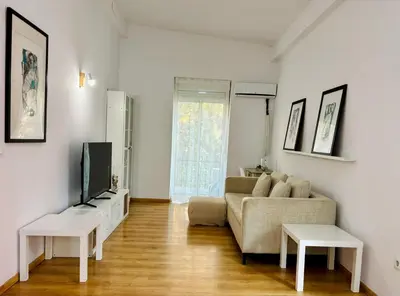 a living room with a couch and a tv at Reina loft in Valencia