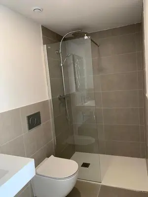 a bathroom with a shower and a toilet and a sink at Gran Canet, sea view 2beds in Canet de Berenguer