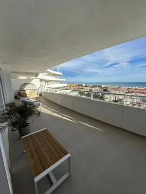 a balcony with a bench and a view of the ocean at Gran Canet, sea view 2beds in Canet de Berenguer