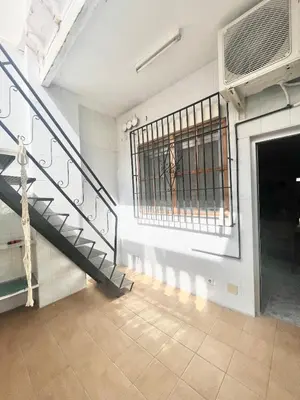 a room with a staircase and a gate in a building at Casa Playa Arenas con Terraza in Valencia