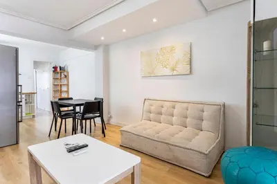 a living room with a couch and a table at GuestReady - Comfort in Valencia in Valencia