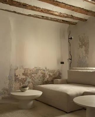 a living room with a couch and a table at Enoa Casa Cueva in Requena