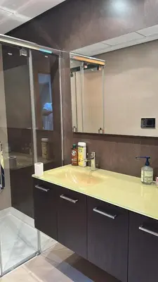 a bathroom with a sink and a mirror at Triplex 4 Bed Penthouse Sea Views Casa Privee - Lux Four bed Two bath Terraces & Balconies in Puerto de Sagunto