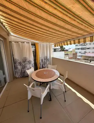 a patio with a table and chairs on a balcony at Triplex 4 Bed Penthouse Sea Views Casa Privee - Lux Four bed Two bath Terraces & Balconies in Puerto de Sagunto