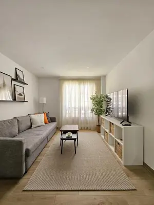 a living room with a couch and a table at Chic Escape Apartment in Godella