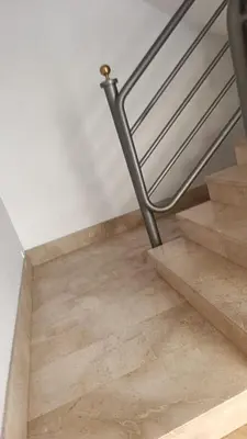 a staircase with a metal handrail and wooden floor at First Floor Casa Privee - Two bed Beach Terrace & Balconies in Puerto de Sagunto